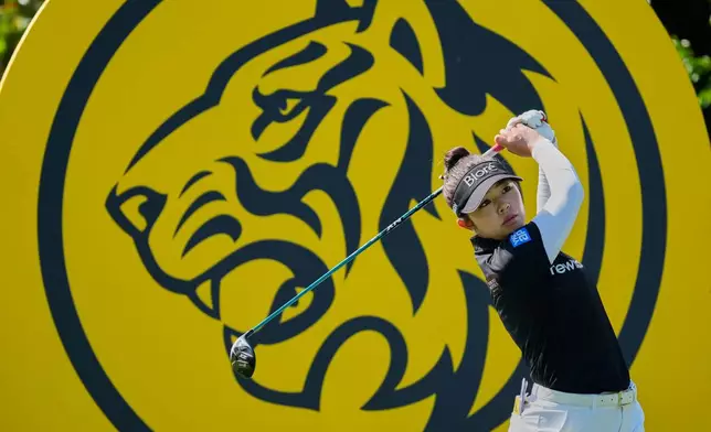 Miyu Yamashita of Japan watches a ball on the 3rd hole during the second day of LPGA Maybank Championship in Kuala Lumpur, Malaysia, Friday, Oct. 30, 2026. (AP Photo/Vincent Thian)