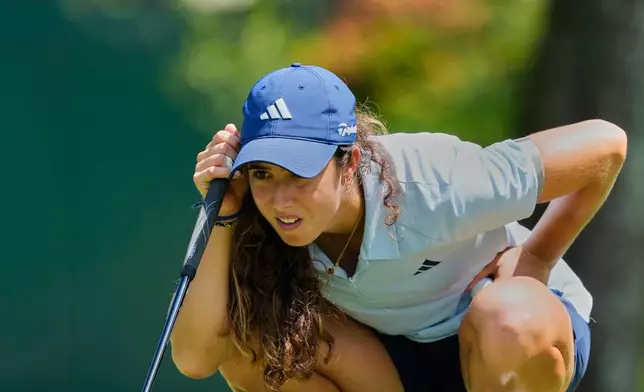 Julia Lopez Ramirez of Spain lines up a putt on the eighth hole during the second day of LPGA Maybank Championship in Kuala Lumpur, Malaysia, Friday, Oct. 30, 2026. (AP Photo/Vincent Thian)