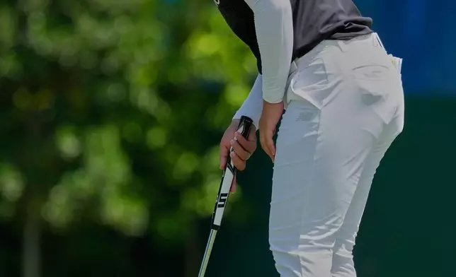 Miyu Yamashita of Japan watches a ball on the eighth hole during the second day of LPGA Maybank Championship in Kuala Lumpur, Malaysia, Friday, Oct. 30, 2026. (AP Photo/Vincent Thian)