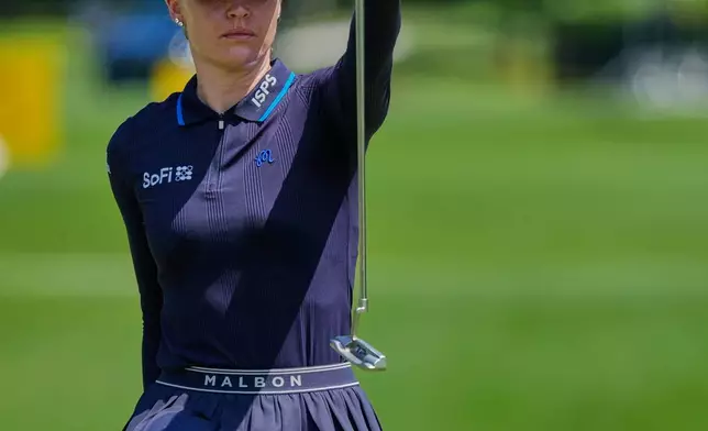 Charley Hull of England lines up a putt on the eighth hole during the second day of LPGA Maybank Championship in Kuala Lumpur, Malaysia, Friday, Oct. 30, 2026. (AP Photo/Vincent Thian)