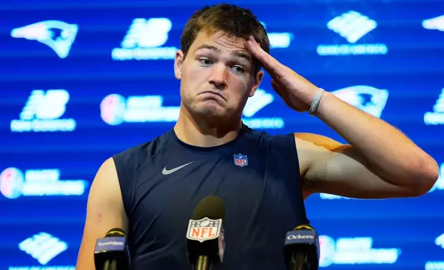 New England Patriots quarterback Drake Maye responds to a question during news conference after an NFL football game against the New York Jets in Foxborough, Mass., Sunday, Oct. 18, 2026. (AP Photo/Charles Krupa)