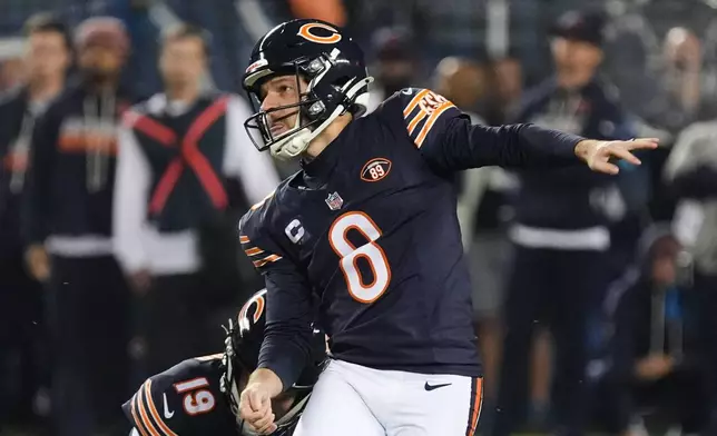 Chicago Bears kicker Cairo Santos (8) watches his 58-yard field goal late in the second half of an NFL football game against the New England Patriots in Chicago, Thursday, Oct. 22, 2026. (AP Photo/David Banks)