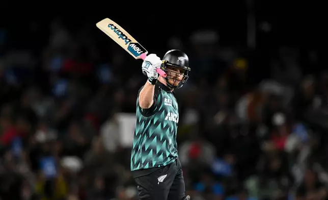 New Zealand's Glenn Phillips celebrates his fifty during the second T20 cricket international between New Zealand and India in Christchurch, New Zealand, Saturday, Oct. 24, 2026. (John Dacidson/Photosport via AP)