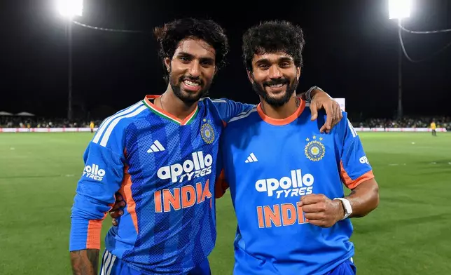 India's Tilak Varma, left, and Nitish Kumar Reddy pose after winning the second T20 cricket international between New Zealand and India in Christchurch, New Zealand, Saturday, Oct. 24, 2026. (John Davidson/Photosport via AP)