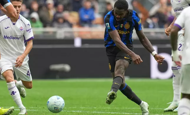 Inter Milan's Marcus Thuram scores his side's opening goal during the Serie A soccer match between Inter Milan and Fiorentina, in Milan, Italy, Sunday, Oct. 25, 2026. (AP Photo/Antonio Calanni)
