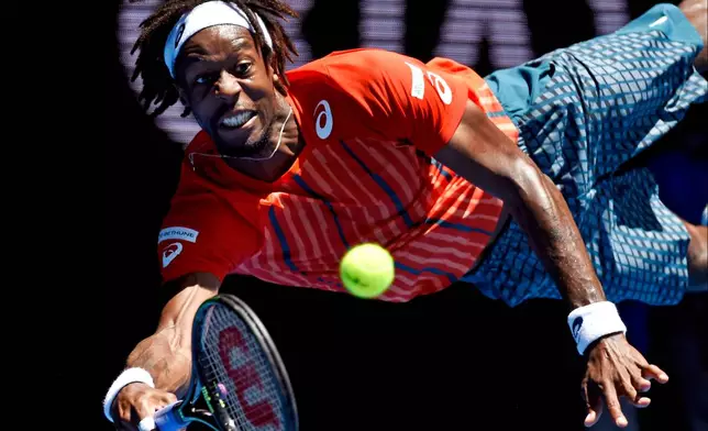 FILE - Gael Monfils of France dives to play a forehand return to Andrey Kuznetsov of Russia during their fourth round match at the Australian Open tennis championships in Melbourne, Australia, Monday, Jan. 25, 2016.(AP Photo/Andrew Brownbill, File)