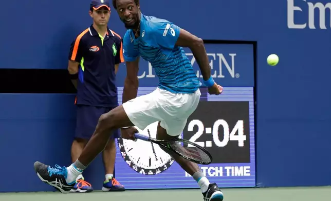 FILE - Gael Monfils, of France, returns a shot to Novak Djokovic, of Serbia, during the semifinals of the U.S. Open tennis tournament, Friday, Sept. 9, 2016, in New York. (AP Photo/Julio Cortez, File)
