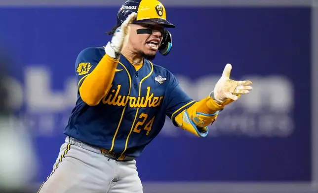 Milwaukee Brewers catcher William Contreras celebrates his RBI double during the sixth inning of Game 5 of baseball's World Series, Wednesday, Oct. 28, 2026, in St. Petersburg, Fla., between the Milwaukee Brewers and the Tampa Bay Rays. (AP Photo/Chris O'Meara)