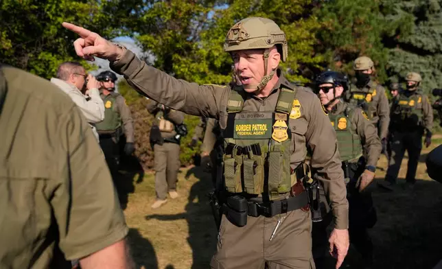 FILE - Greg Bovino, the chief patrol agent for the U.S. Border Patrol El Centro sector, center, walks with federal immigration agents near an Immigration and Customs Enforcement facility in Broadview, Ill., Oct. 3, 2025. (AP Photo/Erin Hooley, File) 