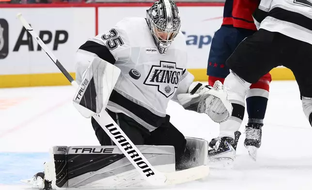 Los Angeles Kings goaltender Darcy Kuemper (35) deflects the puck during the first period of an NHL hockey game against the Washington Capitals, Tuesday, Oct. 20, 2026, in Washington. (AP Photo/Nick Wass)