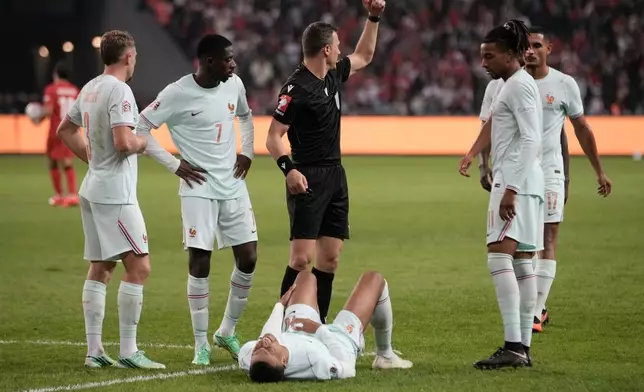 France's Kylian Mbappe lieas on the ground after he scored and injured himself during the UEFA Nations League soccer match between Turkey and France in Izmit, Turkey, Friday, Sept. 25, 2026. (AP Photo/Khalil Hamra)