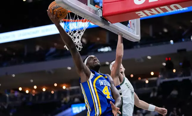 Indiana Pacers forward Pascal Siakam, left, goes up to score against Milwaukee Bucks guard Tyler Herro, right, during the first half of an NBA basketball game Monday, Oct. 26, 2026, in Milwaukee. (AP Photo/Kayla Wolf)