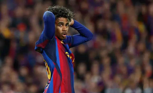 Barcelona's Lamine Yamal reacts after a missed scoring opportunity during a Spanish La Liga soccer match between FC Barcelona and Real Madrid in Barcelona, Spain, Sunday, Oct. 25, 2026. (AP Photo/Joan Monfort)