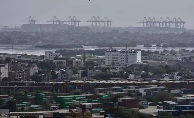 Shipping containers are visible at a port in Karachi, Pakistan, Wednesday, Sept. 30, 2026. (AP Photo/Anjum Naveed)