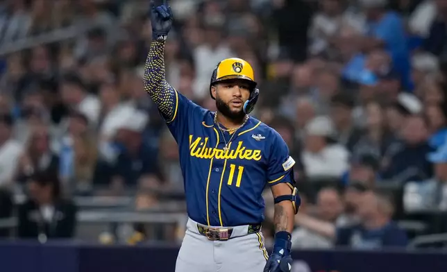 Milwaukee Brewers left fielder Jackson Chourio celebrates his base hit during the fifth inning of Game 3 of baseball's World Series, Monday, Oct. 26, 2026, in St. Petersburg, Fla., between the Milwaukee Brewers and the Tampa Bay Rays. (AP Photo/Chris O'Meara)