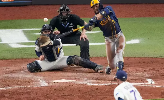 Milwaukee Brewers left fielder Jackson Chourio connects for an RBI double during the fifth inning of Game 3 of baseball's World Series, Monday, Oct. 26, 2026, in St. Petersburg, Fla., between the Milwaukee Brewers and the Tampa Bay Rays. (AP Photo/Morry Gash)