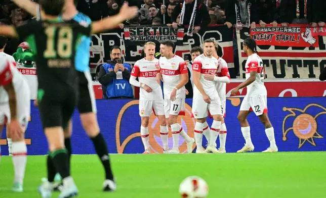 Stuttgart players celebrate a goal during the Bundesliga soccer match between VfB Stuttgart and Borussia Mönchengladbach in Stuttgart, Germany, Friday Oct. 23, 2026. (Jan-Philipp Strobel/dpa via AP)