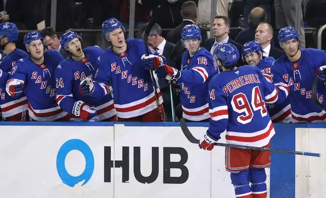 New York Rangers' Gabe Perreault (94) reacts with the bench after scoring during the second period of an NHL hockey game against the Tampa Bay Lightning ,Thursday, Oct. 1, 2026, in New York. (AP Photo/Pamela Smith)