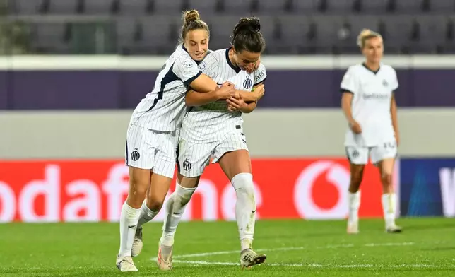 Inter's Ivana Andres Sanz, center, celebrates after scoring against Austria Wien during the Women's Champions League opening-phase soccer match between Austria Wien and Inter in Vienna, Austria, Thursday, Oct. 1, 2026. (AP Photo/Denes Erdos)