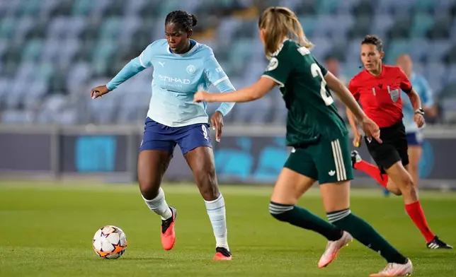 Manchester City's Khadija Shaw, left, and Real Madrid's Bella Andersson in action during the Women's Champions League opening phase soccer match between Manchester City and Real Madrid in Manchester, England, Thursday, Oct. 1, 2026. (AP Photo/Dave Thompson)