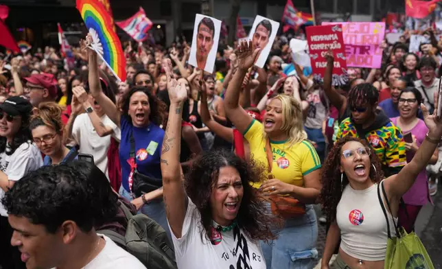 Students march to defend public education and support Brazilian President Luiz Inacio Lula da Silva, who is running for a fourth term, ahead of the presidential runoff election in Rio de Janeiro, Wednesday, Oct. 7, 2026. (AP Photo/Silvia Izquierdo)