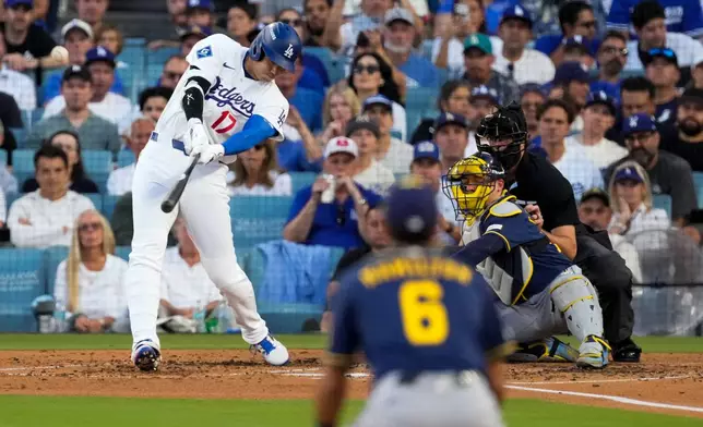 Los Angeles Dodgers designated hitter Shohei Ohtani connects for a three run home during the second inning of Game 4 of baseball's National League Championship Series between the Milwaukee Brewers and the Los Angeles Dodgers, Thursday, Oct. 15, 2026, in Los Angeles. (AP Photo/Mark J. Terrill)
