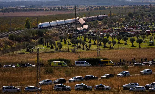 Emergency services work at the scene of a collision between two trains in Urda, Spain, on Wednesday, Oct. 28, 2026. (AP Photo/Manu Fernandez)