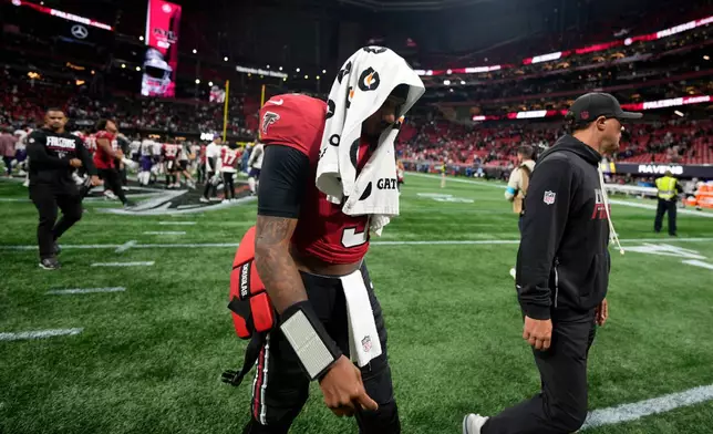 Atlanta Falcons quarterback Michael Penix Jr. walks off the field after a NFL football game against the Baltimore Ravens, Sunday, Oct. 11, 2026, in Atlanta. (AP Photo/Mike Stewart)
