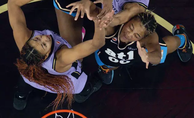 Golden State Valkyries center Kiah Stokes (41) and forward Gabby Williams (1) and Atlanta Dream forward Angel Reese (5) and forward Naz Hillmon (00) compete for a rebound during the first half of Game 5 of the WNBA basketball finals in San Francisco, Monday, Oct. 26, 2026. (Carlos Avila Gonzalez/San Francisco Chronicle via AP)