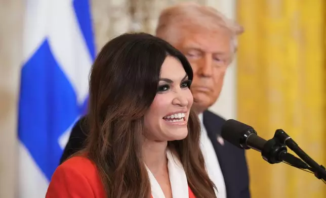 FILE - Kimberly Guilfoyle speaks as President Donald Trump listens at a reception celebrating Greek Independence Day in the East Room of the White House, March 24, 2025, in Washington. (AP Photo/Jacquelyn Martin, File)