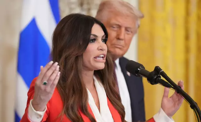 FILE - Kimberly Guilfoyle speaks as President Donald Trump listens at a reception celebrating Greek Independence Day in the East Room of the White House, March 24, 2025, in Washington. (AP Photo/Jacquelyn Martin, File)