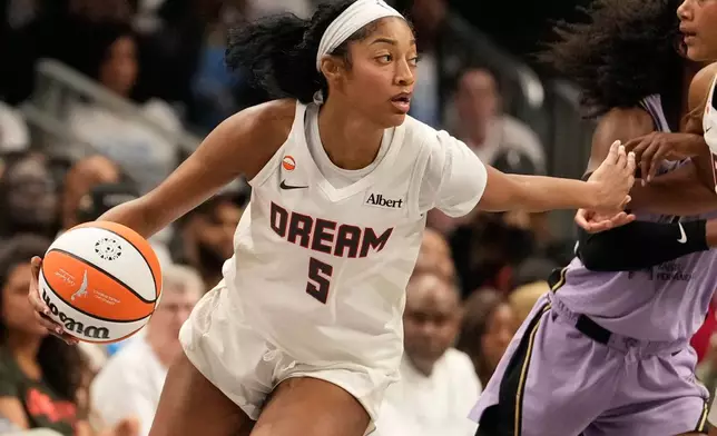 Atlanta Dream forward Angel Reese (5) dribbles the ball during Game 4 of the WNBA basketball finals against the Golden State Valkyries on Saturday, Oct. 24, 2026, in Atlanta. (AP Photo/Brynn Anderson)
