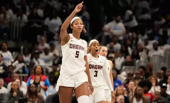 Atlanta Dream forward Angel Reese (5) and Atlanta Dream guard Jordin Canada (3) react to a foul in the second half during Game 4 of the WNBA basketball finals on Saturday, Oct. 24, 2026, in Atlanta. (AP Photo/Brynn Anderson)
