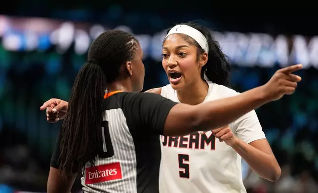 Atlanta Dream forward Angel Reese (5) talks to a referee during Game 4 of the WNBA basketball finals against the Golden State Valkyries on Saturday, Oct. 24, 2026, in Atlanta. (AP Photo/Brynn Anderson)