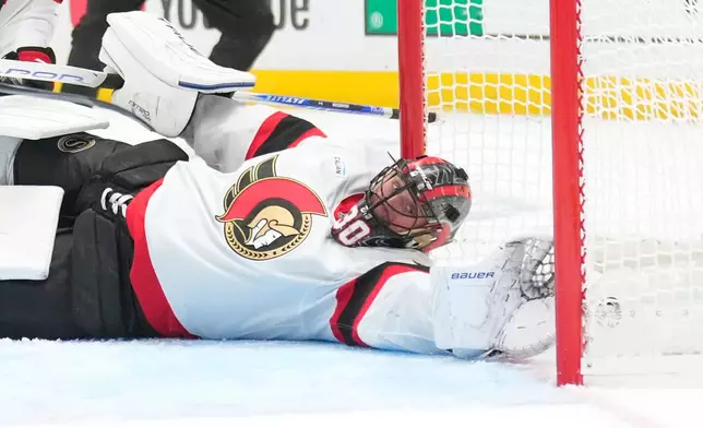Ottawa Senators goaltender Jonas Johansson can't reach a puck shot by Los Angeles Kings right wing Joel Armia during the second period of an NHL hockey game Thursday, Oct. 29, 2026, in Los Angeles. (AP Photo/Mark J. Terrill)