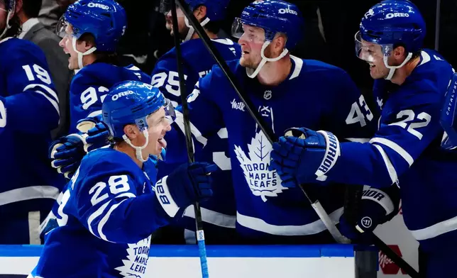 Toronto Maple Leafs' Troy Stecher (28) celebrates after his goal against the New York Rangers during the third period of an NHL hockey game in Toronto, Thursday, Oct. 22, 2026. (Frank Gunn/The Canadian Press via AP)
