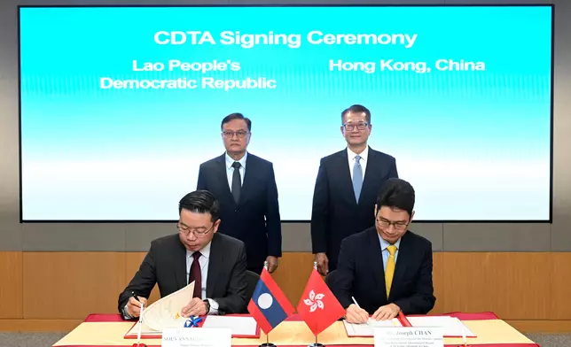 The Financial Secretary, Mr Paul Chan (back row, right), and the Deputy Prime Minister and Minister of Finance of Laos, Mr Santiphab Phomvihane (back row, left) witnessed today (October 29) the signing of a comprehensive avoidance of double taxation agreement by the Acting Secretary for Financial Services and the Treasury, Mr Joseph Chan (front row, right), and Deputy Minister of Finance of Laos Mr Soulivath Souvannachoumkham (front row, left) on behalf of the Hong Kong Special Administrative Region Government and the Government of Laos respectively. Source: HKSAR Government Press Releases