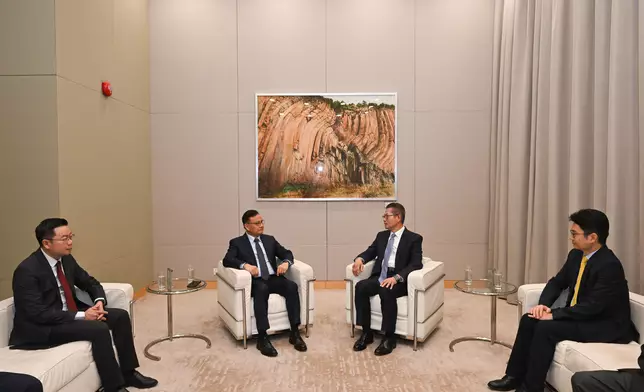 The Financial Secretary, Mr Paul Chan (second right), had a bilateral meeting today (October 29) with the Deputy Prime Minister and Minister of Finance of Laos, Mr Santiphab Phomvihane (second left). Photo shows Mr Chan highlighting to Mr Phomvihane the latest developments of Hong Kong as an international financial centre, including its advantages in areas such as capital market, green and sustainable finance, wealth management, global competitiveness and tax policy, as well as the HKSAR Government's initiatives to develop Hong Kong into a global gold trading, clearing and reserve hub. They also explored further collaboration to drive high-quality development along the Belt and Road together. Also in attendance are the Acting Secretary for Financial Services and the Treasury, Mr Joseph Chan (first right), and Deputy Minister of Finance of Laos Mr Soulivath Souvannachoumkham (first left). Source: HKSAR Government Press Releases