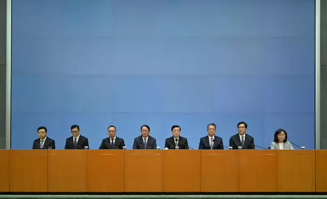 The Chief Executive, Mr John Lee (fourth right), together with the Chief Secretary for Administration, Mr Chan Kwok-ki (fourth left); the Financial Secretary, Mr Paul Chan (third right); the Secretary for Justice, Mr Paul Lam, SC (third left); the Deputy Financial Secretary and Acting Secretary for Housing, Mr Michael Wong (second right); the Secretary for Security, Mr Tang Ping-keung (second left); the Secretary for Development, Ms Bernadette Linn (first right); and the Secretary for Labour and Welfare, Mr Chris Sun (first left), hold a government press conference today (October 29) on matters relevant to the report of the Independent Committee in relation to the fire at Wang Fuk Court in Tai Po. Source: HKSAR Government Press Releases