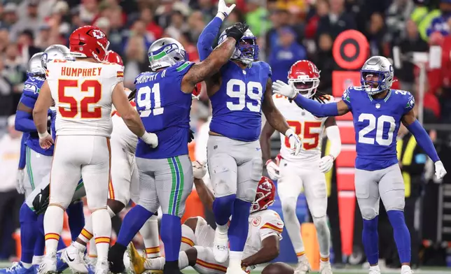 Seattle Seahawks defensive tackle Leonard Williams (99) reacts after tackling Kansas City Chiefs running back Kenneth Walker III during the second half of an NFL football game in Seattle, Sunday, Oct. 25, 2026. (AP Photo/Kevin Ng)