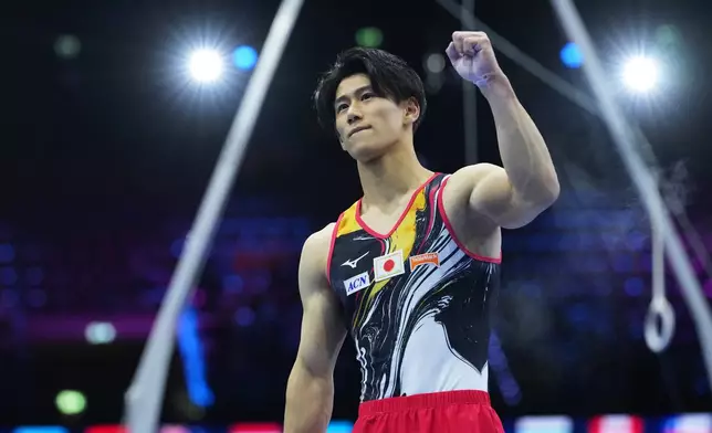 Daiki Hashimoto, of Japan, gestures after performing in the rings during the the men's team final at the Artistic Gymnastics World Championships in Rotterdam, the Netherlands, Tuesday, Oct. 20, 2026. (AP Photo/Francisco Seco)