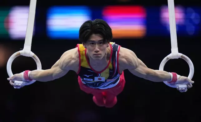 Daiki Hashimoto, of Japan, competes in the rings during the the men's team final at the Artistic Gymnastics World Championships in Rotterdam, the Netherlands, Tuesday, Oct. 20, 2026. (AP Photo/Francisco Seco)