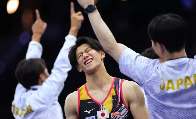 Daiki Hashimoto, of Japan, reacts after winning the men's team final at the Artistic Gymnastics World Championships in Rotterdam, the Netherlands, Tuesday, Oct. 20, 2026. (AP Photo/Francisco Seco)