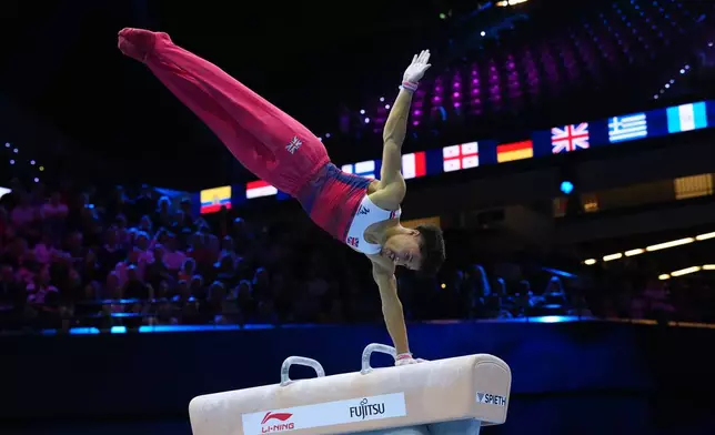 Jake Jarman, of Britain, competes in the pommel horse during the the men's team final at the Artistic Gymnastics World Championships in Rotterdam, the Netherlands, Tuesday, Oct. 20, 2026. (AP Photo/Patrick Post)