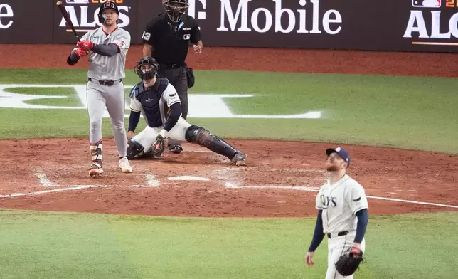 Cleveland Guardians' Patrick Bailey watches his home run against the Tampa Bay Rays during the seventh inning in Game 1 of an American League Championship Series baseball game in St. Petersburg, Fla. Monday, Oct. 12, 2026. (AP Photo/Chris O'Meara)