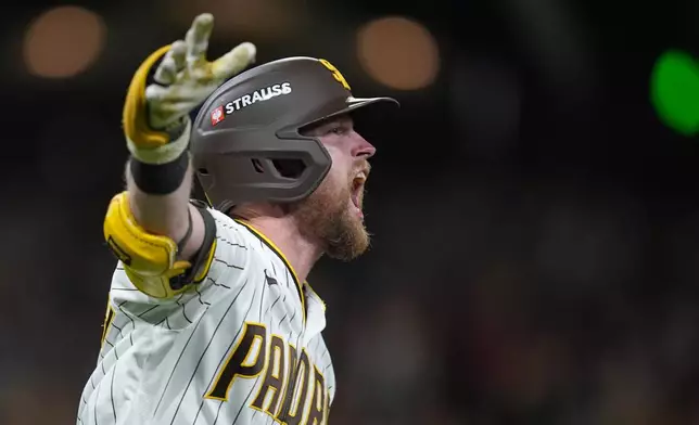 San Diego Padres' Jake Cronenworth celebrates after hitting a solo home run during the fifth inning in Game 3 of baseball's National League Division Series against the Milwaukee Brewers Tuesday, Oct. 6, 2026, in San Diego. (AP Photo/Gregory Bull)