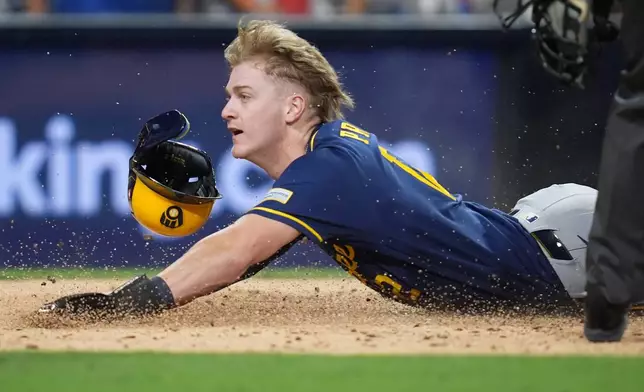 Milwaukee Brewers' Cooper Pratt scores during the fifth inning in Game 3 of baseball's National League Division Series against the San Diego Padres Tuesday, Oct. 6, 2026, in San Diego. (AP Photo/Gregory Bull)
