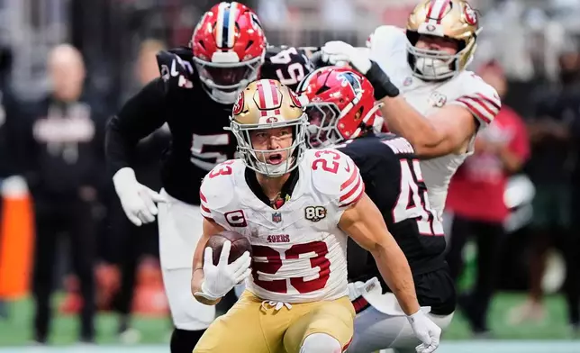 San Francisco 49ers running back Christian McCaffrey (23) runs the ball during the second half of an NFL football game against the Atlanta Falcons in Atlanta, Sunday, Oct. 25, 2026. (AP Photo/Brynn Anderson)