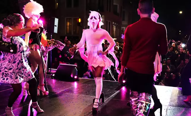 People show off their heels ahead of the annual 17th Street High Heel Race, Tuesday, Oct. 27, 2026, in Washington. (AP Photo/Julia Demaree Nikhinson)