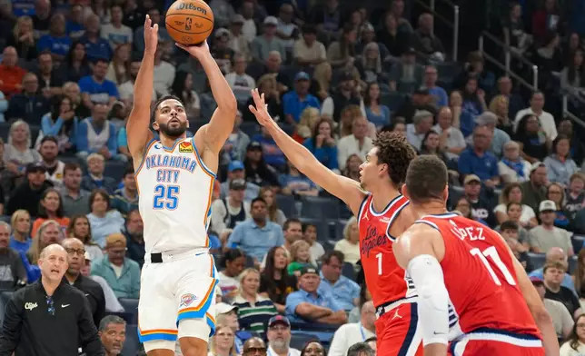 Oklahoma City Thunder guard Ajay Mitchell (25) shoots over Los Angeles Clippers guard Keaton Wagler (1) and center Brook Lopez (11) during the first half of an NBA basketball game, Sunday, Oct. 25, 2026, in Oklahoma City. (AP Photo/Kyle Phillips)